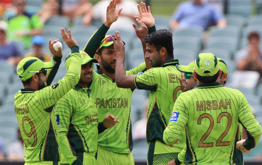 Pakistan's Ehsan Adil, fourth left, celebrates with teammates the wicket of Ireland's Paul Stirling during their Cricket World Cup Pool B match in Adelaide, Australia.