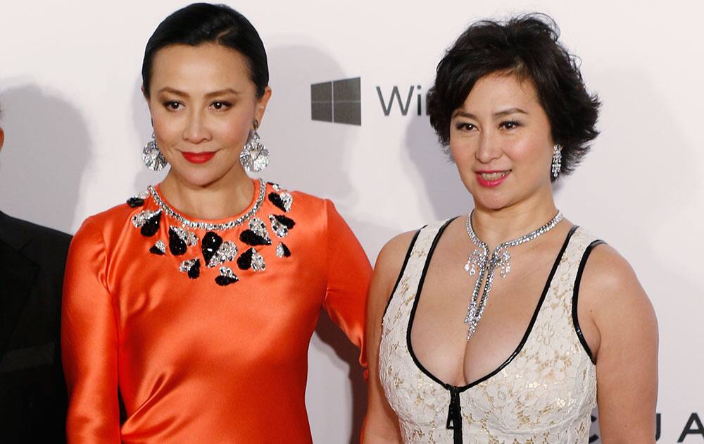 Hong Kong actress Carina Lau, left, and Pansy Ho, Managing Director of Shun Tak Holdings pose on the red carpet for the fundraising gala organized by amfAR (The Foundation for AIDS Research) in Hong Kong.