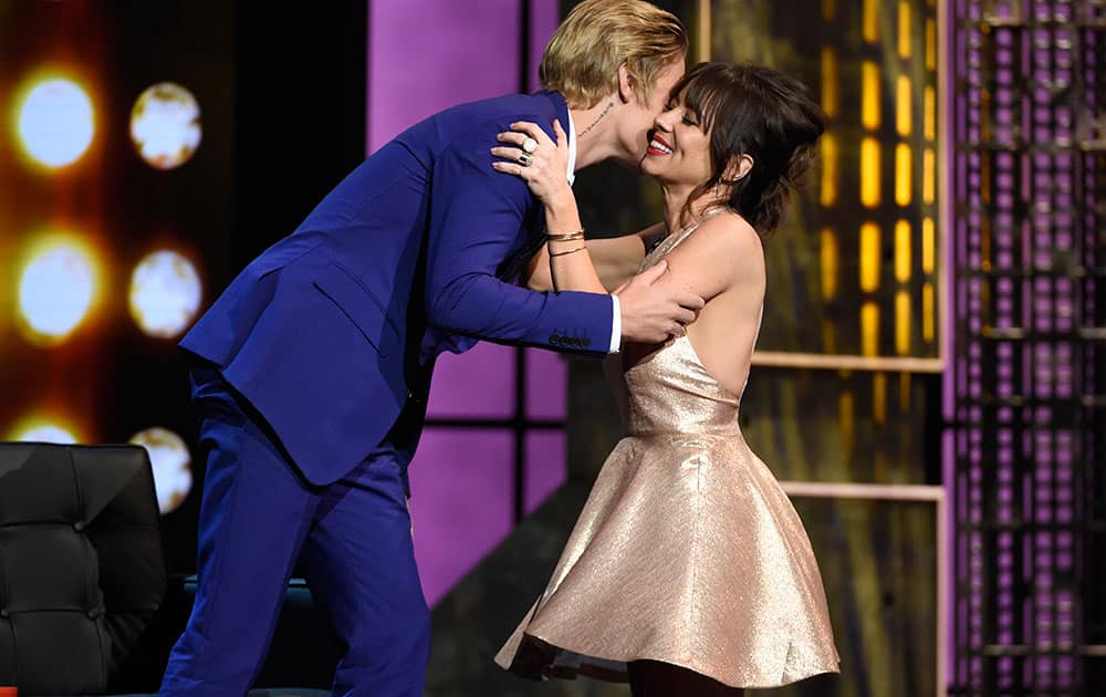 Justin Bieber, left, greets Natasha Leggero on stage at the Comedy Central Roast of Justin Bieber at Sony Pictures Studios on Saturday, March 14, 2015, in Culver City, Calif. 