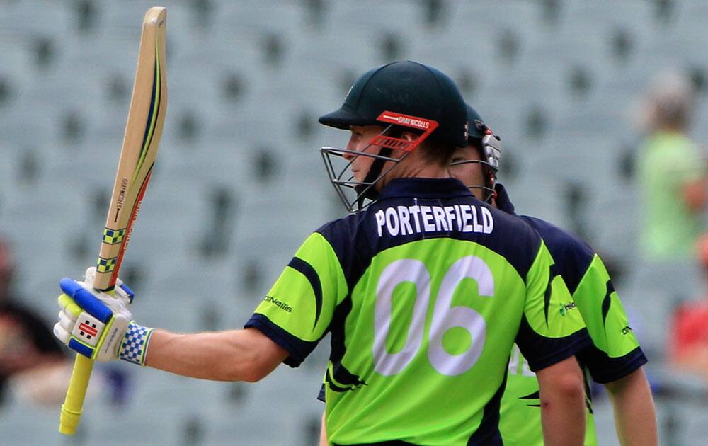 Ireland's captain William Porterfield acknowledges his fifty runs during their Cricket World Cup Pool B match against Pakistan in Adelaide, Australia.