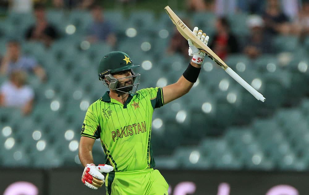 Pakistan’s Ahmed Shahzad, acknowledges his fifty runs during their Cricket World Cup Pool B match against Ireland in Adelaide, Australia.