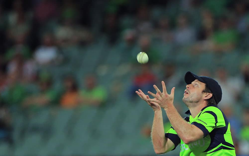 Ireland's Ed Joyce, prepares to take a catch to dismiss Pakistan’s Ahmed Shahzad, during their Cricket World Cup Pool B match in Adelaide, Australia.