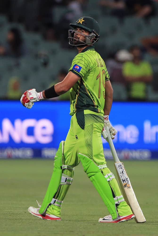 Pakistan’s Ahmed Shahzad, awlks back after his dismissal during their Cricket World Cup Pool B match against Ireland in Adelaide, Australia.