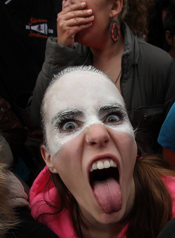 A music fan gestures to the camera during the Vive Latino Music Festival in Mexico City.