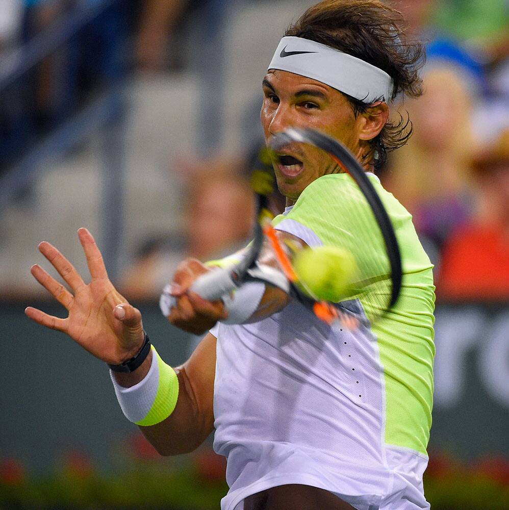 Rafael Nadal, of Spain, returns to Igor Sijsling, of the Netherlands, during their match at the BNP Paribas Open tennis tournament.