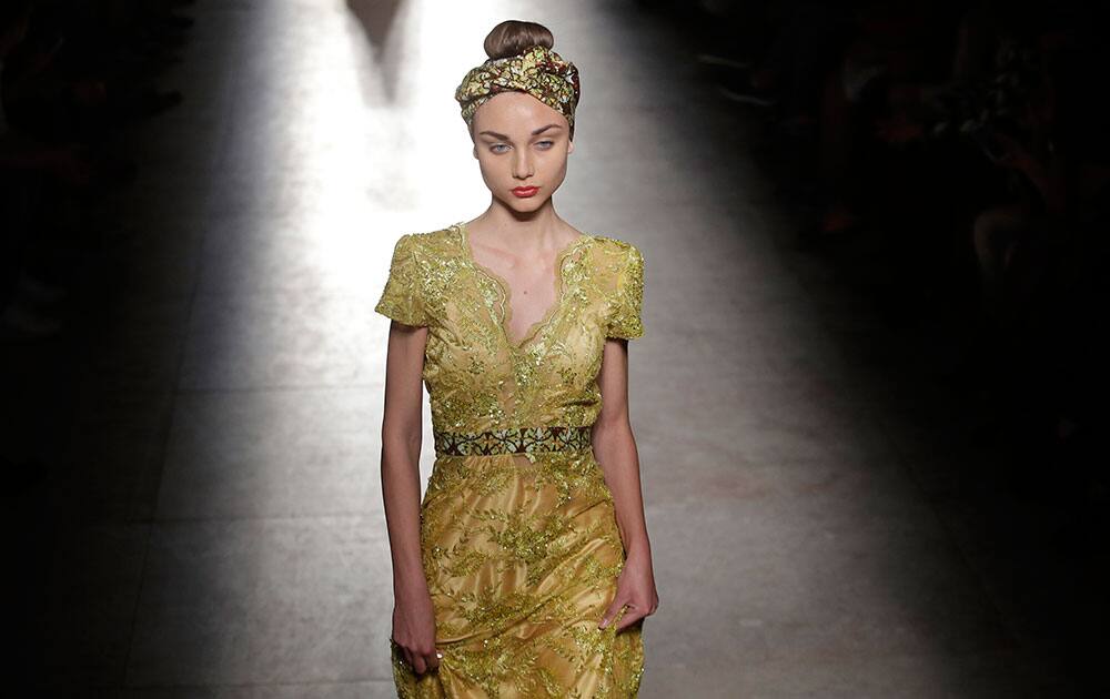 Models display creations by Angolan designer Nadir Tati during the ModaLisboa fashion week, in Lisbon, Portugal.