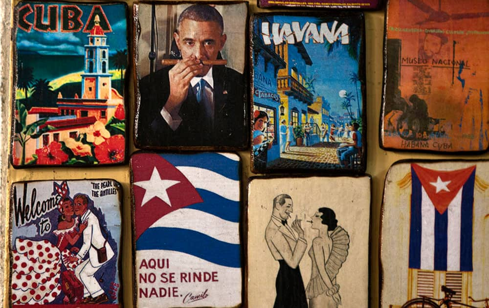 Magnets for sale decorate a tourist shop, one showing an image of U.S. President Barack Obama smelling a cigar, at a market in Havana, Cuba.