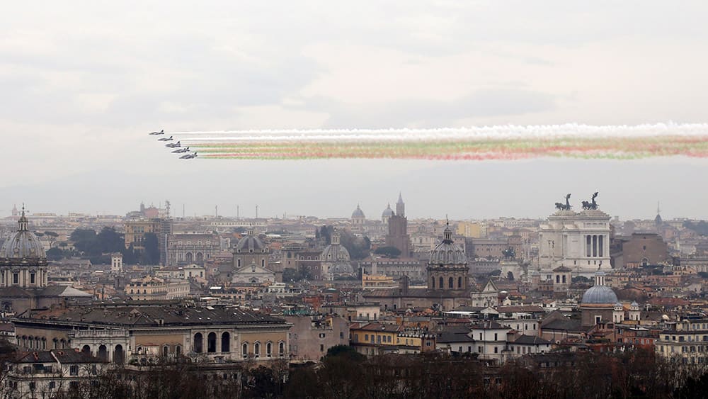 The 'Frecce Tricolori' Italian Air Force acrobatic squad fly over Rome, to mark the 154th anniversary of the Italian Unification in 1861.