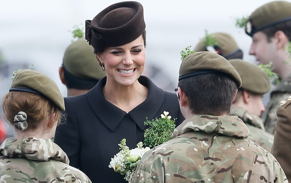 Britain's Kate, the Duchess of Cambridge meets cadets during a visit to the 1st Battalion Irish Guards at the St. Patrick's Day Parade at Mons Barracks, Aldershot, in England.