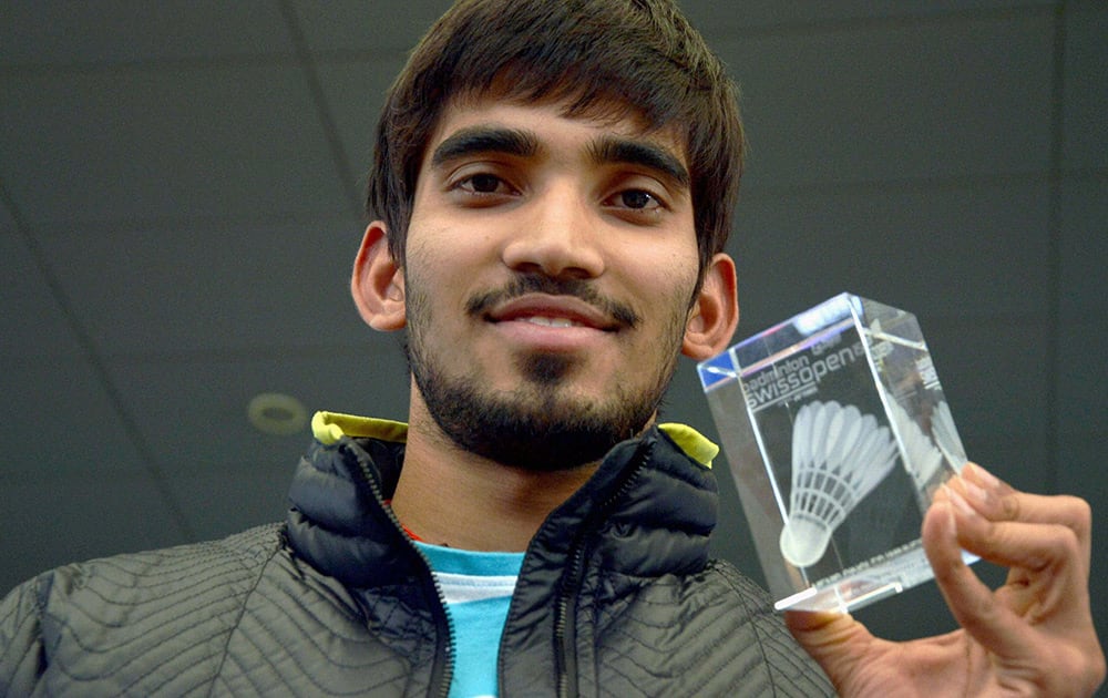 Ace shuttler Kidambi Srikanth, winner of Swiss Open Grand Prix Gold 2015 trophy, on his arrival at Shamshabad Airport near Hyderabad from Switzerland.