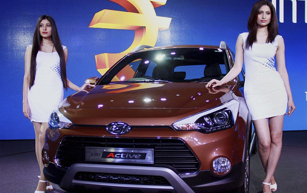 Models pose at launch of Hyundai Motors India Ltds new i20 ACTIVE in New Delhi.