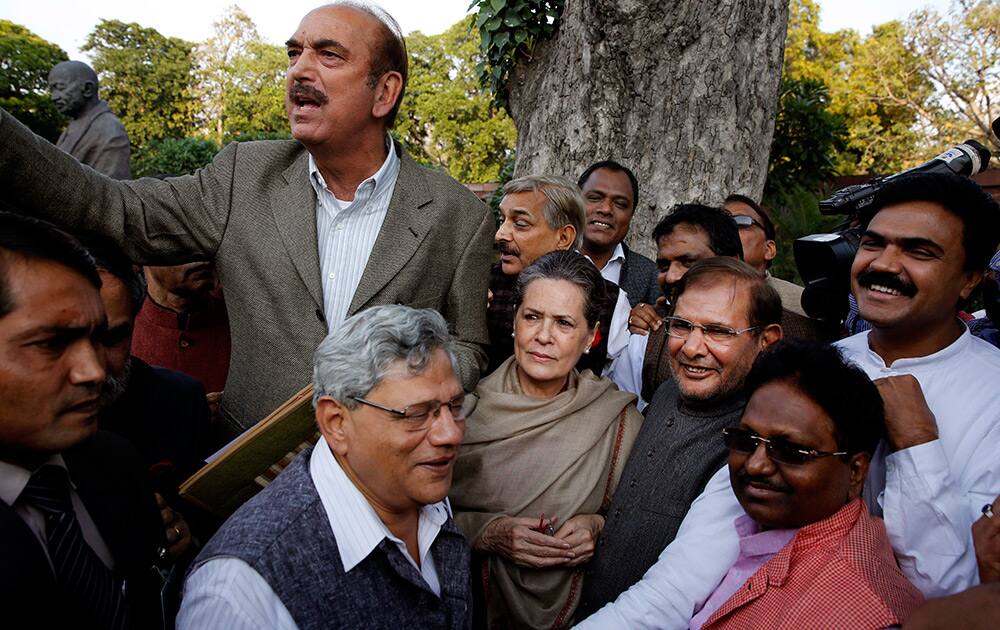 Congress party President Sonia Gandhi, Communist Party of India (Marxist) leader Sitaram Yechury, Janata Dal (United) leader Sharad Yadav, Congress party leader Ghulam Nabi Azad and other lawmakers gather at parliament house to participate in a march against the ruling Bharatiya Janata Party’s Land Acquisition Bill in New Delhi.