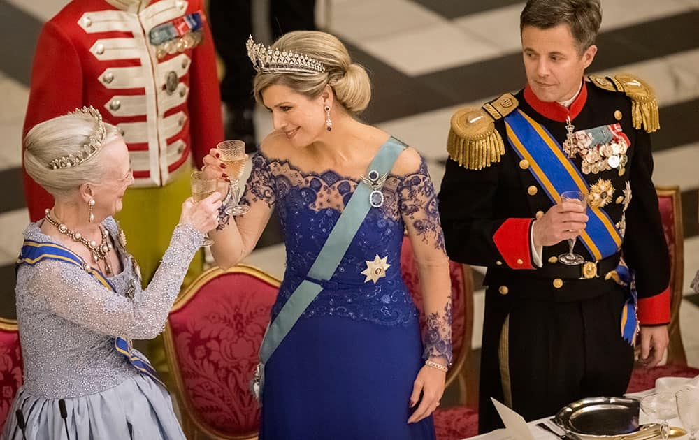 Denmark's Queen Margrethe, left, Queen Maxima of the Netherlands, and Denmark's Crown Prince Frederik toast during a Gala Dinner at Christiansborg Palace, in Copenhagen, Denmark.