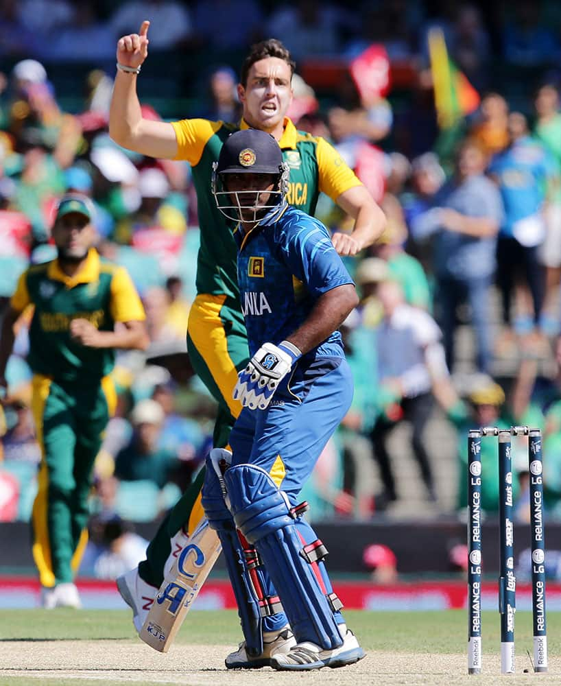 Sri Lanka's Kusal Perera looks back to see he is out caught off the bowling of South Africa's Kyle Abbott during their Cricket World Cup quarterfinal match in Sydney, Australia.