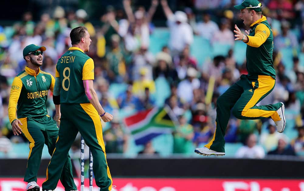 South Africa's Dale Steyn celebrates with teammates David Miller, right, and JP Duminy, left, after taking the wicket of Sri Lanka's Tillakaratne Dilshan during their Cricket World Cup quarterfinal match in Sydney, Australia.