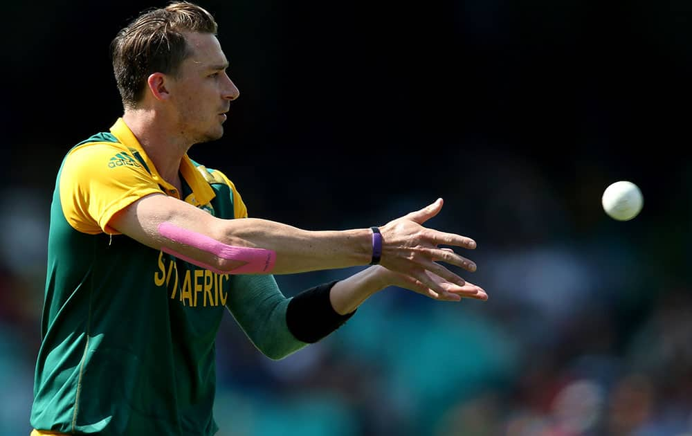 South Africa's Dale Steyn takes the ball from a teammate during their Cricket World Cup quarterfinal match against Sri Lanka in Sydney, Australia.