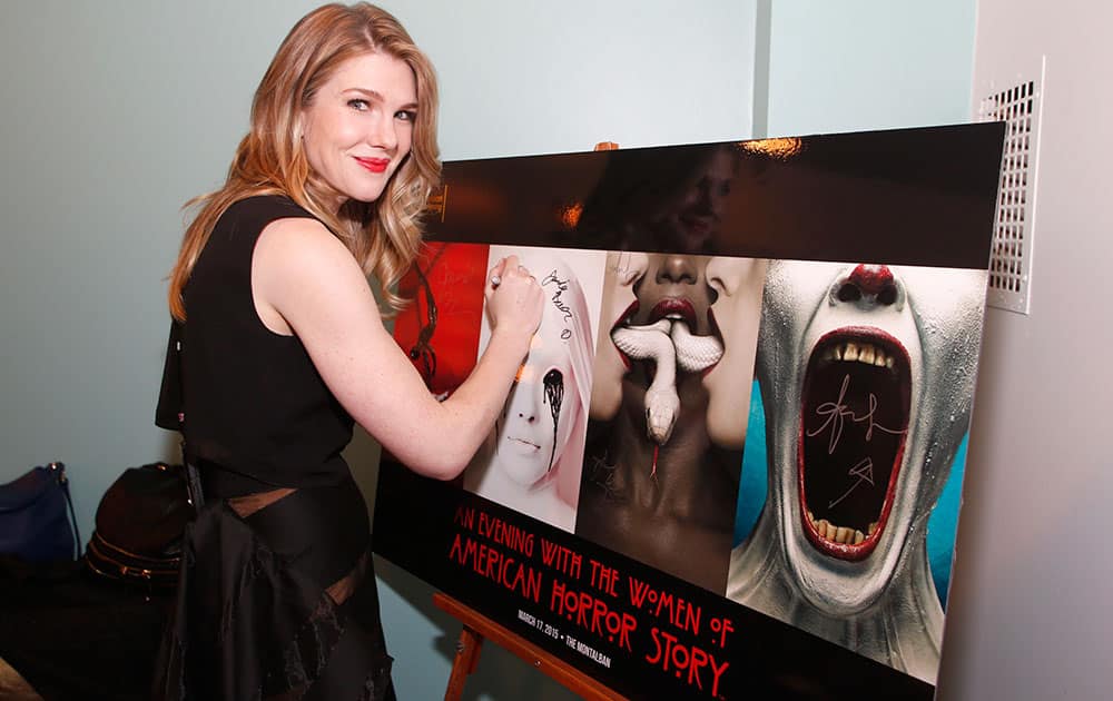 Lily Rabe signs the event poster backstage for the Television Academy’s member event, “An Evening with the Women of American Horror Story,”  at The Montalban in Hollywood, Calif.