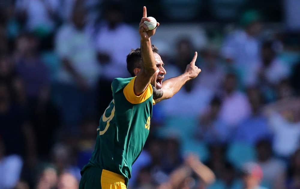 South Africa's Imran Tahir celebrates after taking the wicket of Sri Lanka's Lahiru Thirimanne during their Cricket World Cup quarterfinal match in Sydney, Australia.