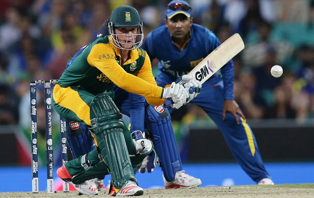 South Africa's Quinton De Kock looks to play a sweep shot while batting against Sri Lanka during their Cricket World Cup quarterfinal match in Sydney, Australia.