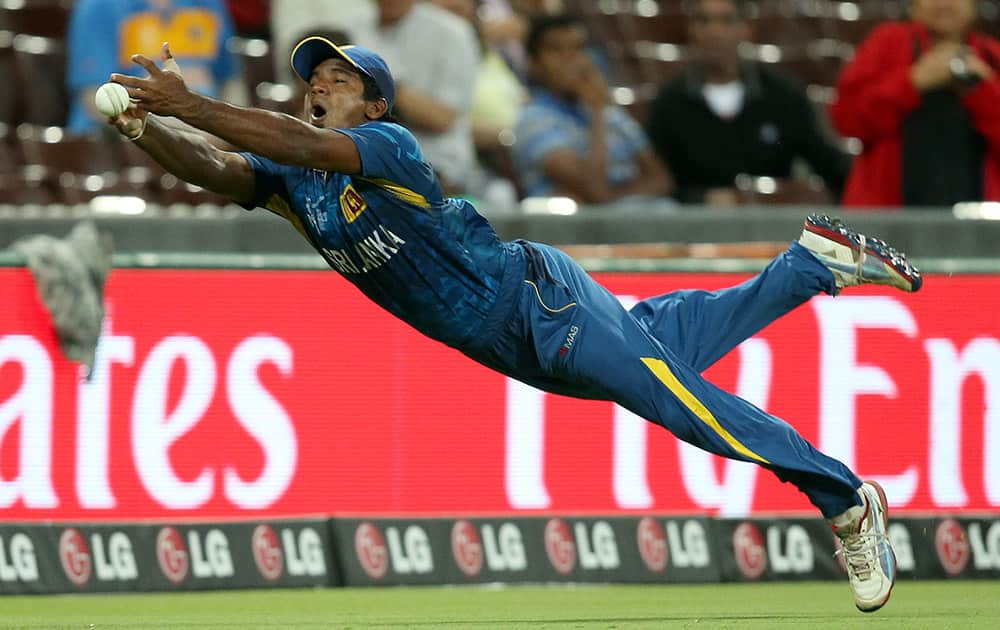 Sri Lanka's Kusal Perera drops a catch during their Cricket World Cup quarterfinal match against South Africa in Sydney, Australia.