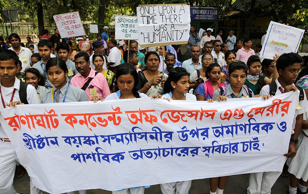 School children and others participate in an all-religion silent rally protesting the rape of an elderly nun at a convent in Ranaghat, in Kolkata.