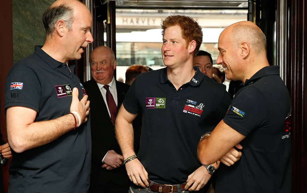 Britain's Prince Harry, is greeted by Ed Parker, the founder and CEO of the charity Walking with the Wounded, as he arrives for the launch of the Walking with the Wounded, Walk of Britain charity event, in London.