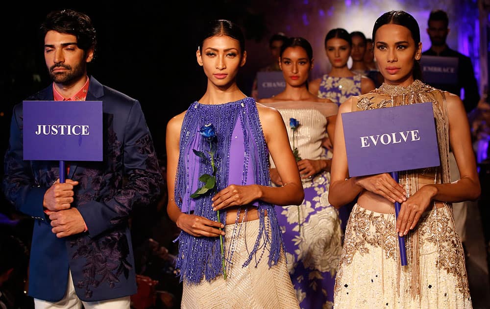 Models display creations by Manish Malhotra during the Lakme Fashion Week Summer Resort 2015 in Mumbai.