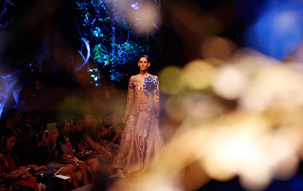 A model displays a creation by Manish Malhotra during the Lakme Fashion Week Summer Resort 2015 in Mumbai.