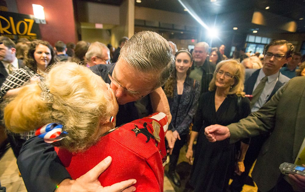 Former Florida Governor and potential presidential candidate Jeb Bush kisses JoAnn Wiegand, one of the founding members of the Horry County Republican party following a speech in Myrtle Beach, S.C.