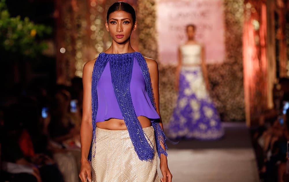 Models display creations by Manish Malhotra during the Lakme Fashion Week Summer Resort 2015 in Mumbai.