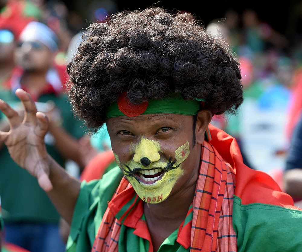 A Bangladesh fan cheers his team during their Cricket World Cup quarterfinal match against India in Melbourne, Australia.