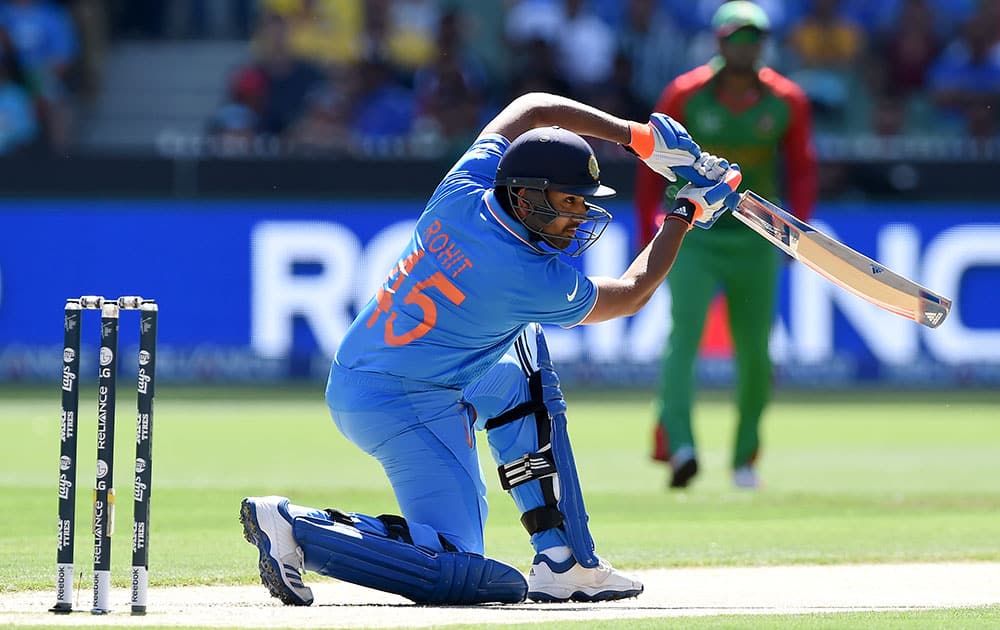 India's Rohit Sharma plays a shot while batting against Bangladesh during their Cricket World Cup quarterfinal match in Melbourne, Australia.