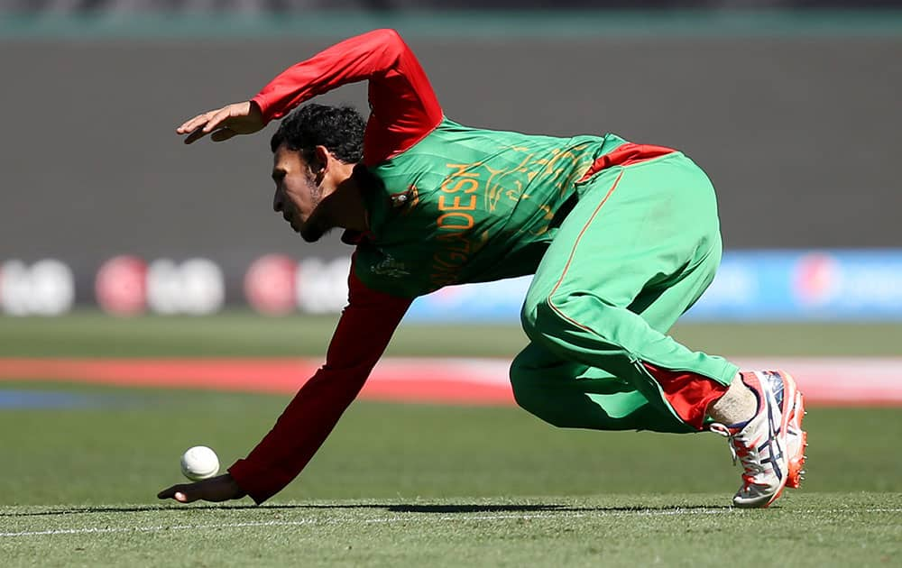 Bangladesh’s Nasir Hossain reaches out to field the ball during their Cricket World Cup quarterfinal match against India in Melbourne, Australia.