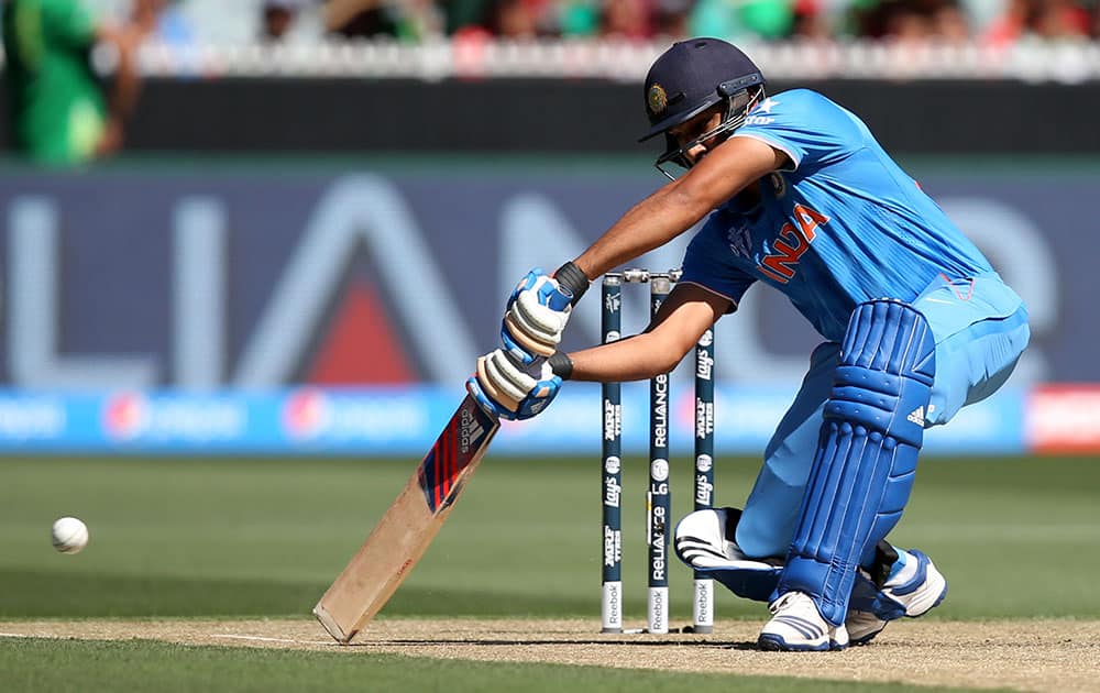 India's Rohit Sharma plays a shot while batting against Bangladesh during their Cricket World Cup quarterfinal match in Melbourne, Australia.