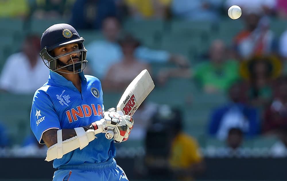 India's Shikhar Dhawan lets a ball pass while batting against Bangladesh during their Cricket World Cup quarterfinal match in Melbourne, Australia.