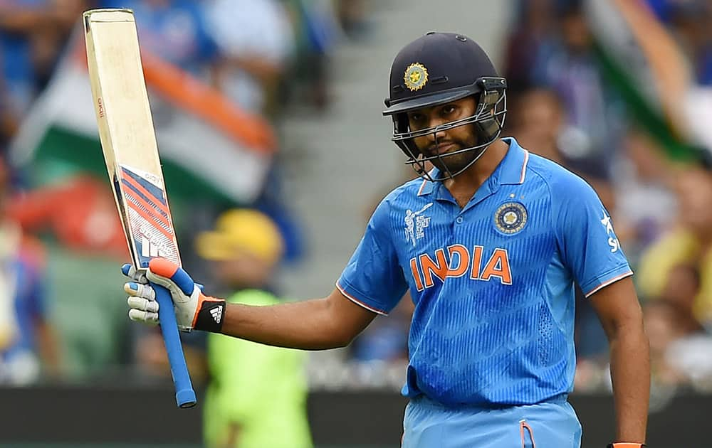 Rohit Sharma waves his bat after reaching 50 runs while batting against Bangladesh during their Cricket World Cup quarterfinal match in Melbourne.