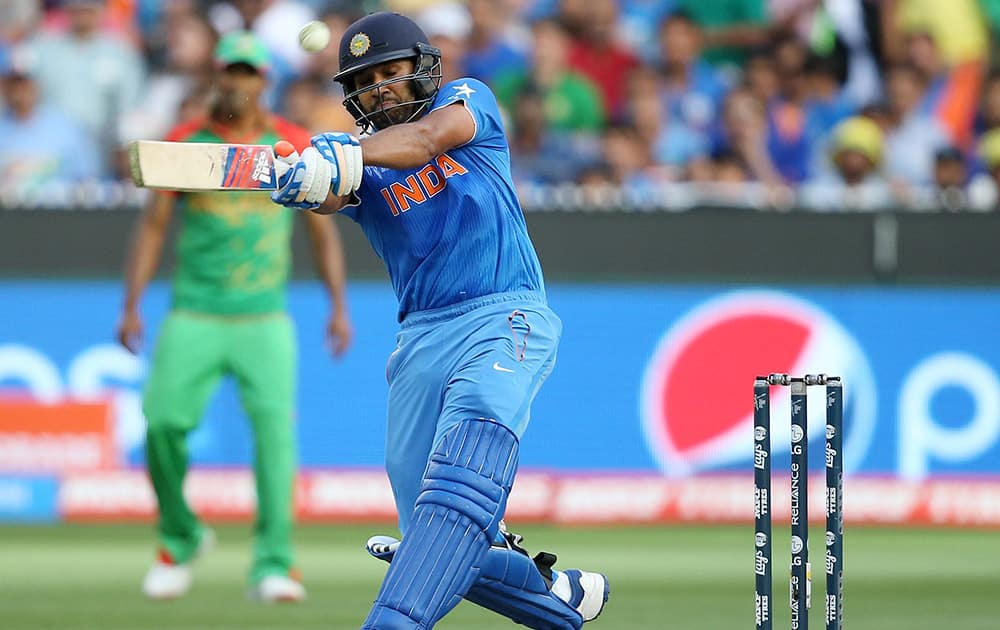 Rohit Sharma hits the ball while batting against Bangladesh during their Cricket World Cup quarterfinal match in Melbourne, Australia.