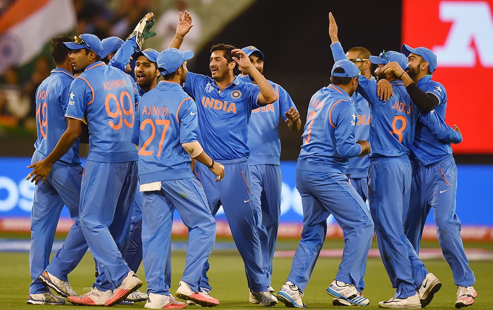 Players celebrate the run out of Bangladesh's Imrul Kayes during their Cricket World Cup quarterfinal match in Melbourne.