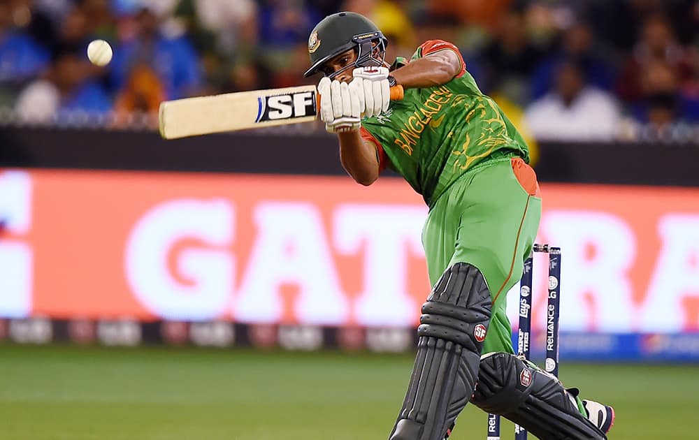 Bangladesh’s Mahmudullah hits the ball while batting against India during their Cricket World Cup quarterfinal match in Melbourne.