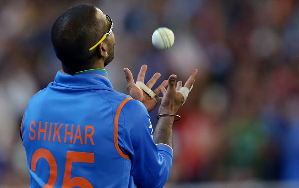 Shikhar Dhawan takes a catch on his second attempt to dismiss Bangladesh’s Mahmudullah during their Cricket World Cup quarterfinal match in Melbourne.