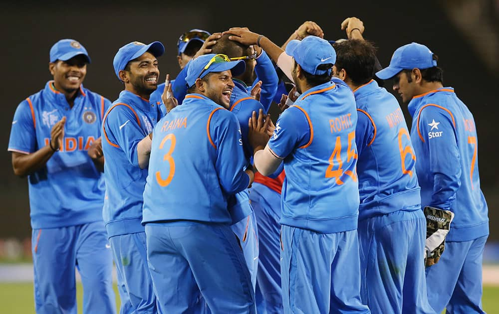 Players celebrate the dismissal of Bangladesh’s Mahmudullah during their Cricket World Cup quarterfinal match in Melbourne, Australia.