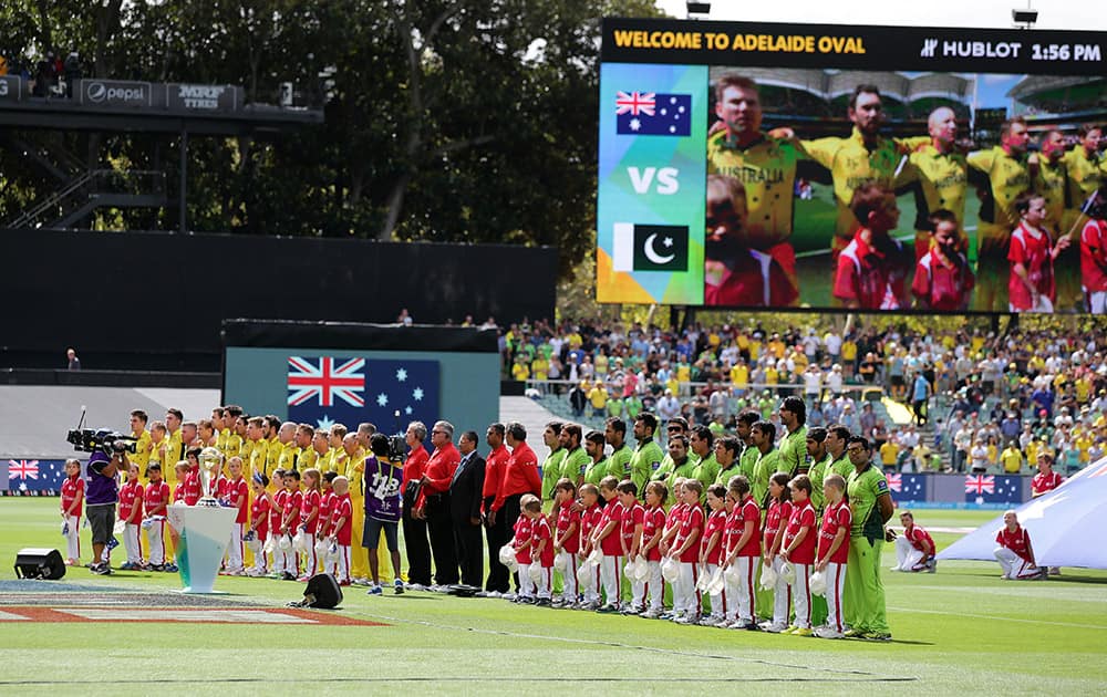 The Pakistan and Australian teams line up ahead of their Cricket World Cup quarterfinal match in Adelaide, Australia.