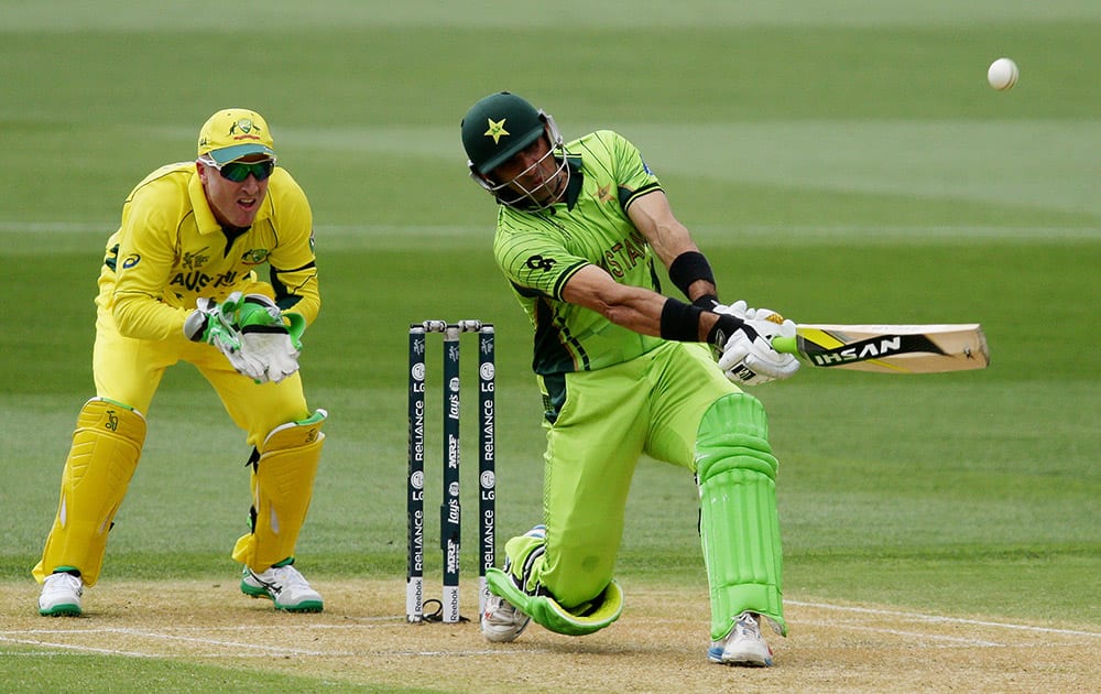 Pakistan's captain Misbah Ul Haq hits the ball as Australia's wicketkeeper Brad Haddin watches during their Cricket World Cup quarterfinal match in Adelaide.