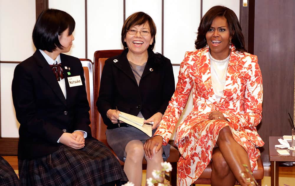 US first lady Michelle Obama, reacts as she talks with participants during the roundtable meeting as part of Japan-US Joint Girls Education event at Iikura Guest House in Tokyo.