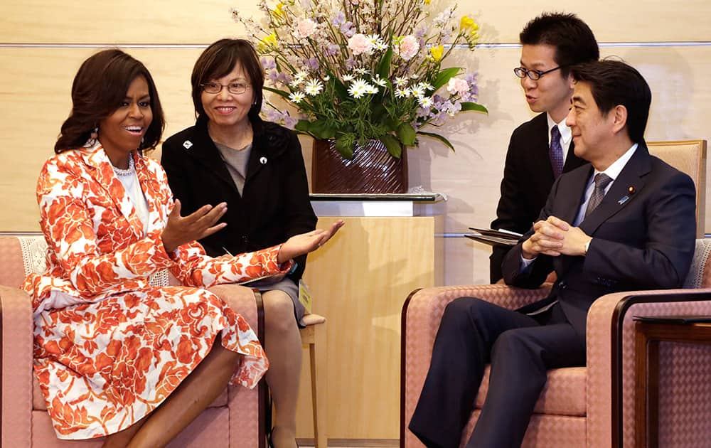 US first lady Michelle Obama, talks with Japanese Prime Minister Shinzo Abe, during a meeting at the prime minister's official residence in Tokyo.