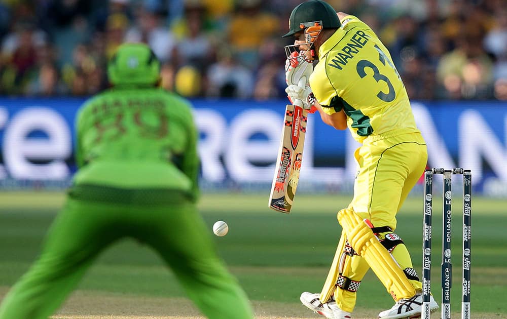 Australia's David Warner plays a shot while batting against Pakistan during their Cricket World Cup quarterfinal match in Adelaide, Australia.