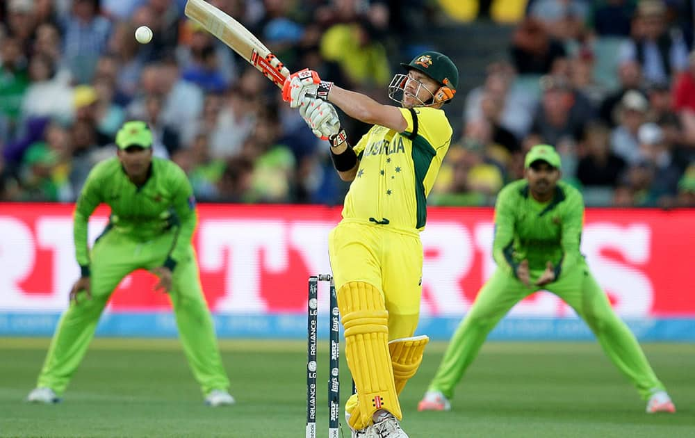 Australia's David Warner hits the ball while batting against Pakistan during their Cricket World Cup quarterfinal match in Adelaide, Australia.