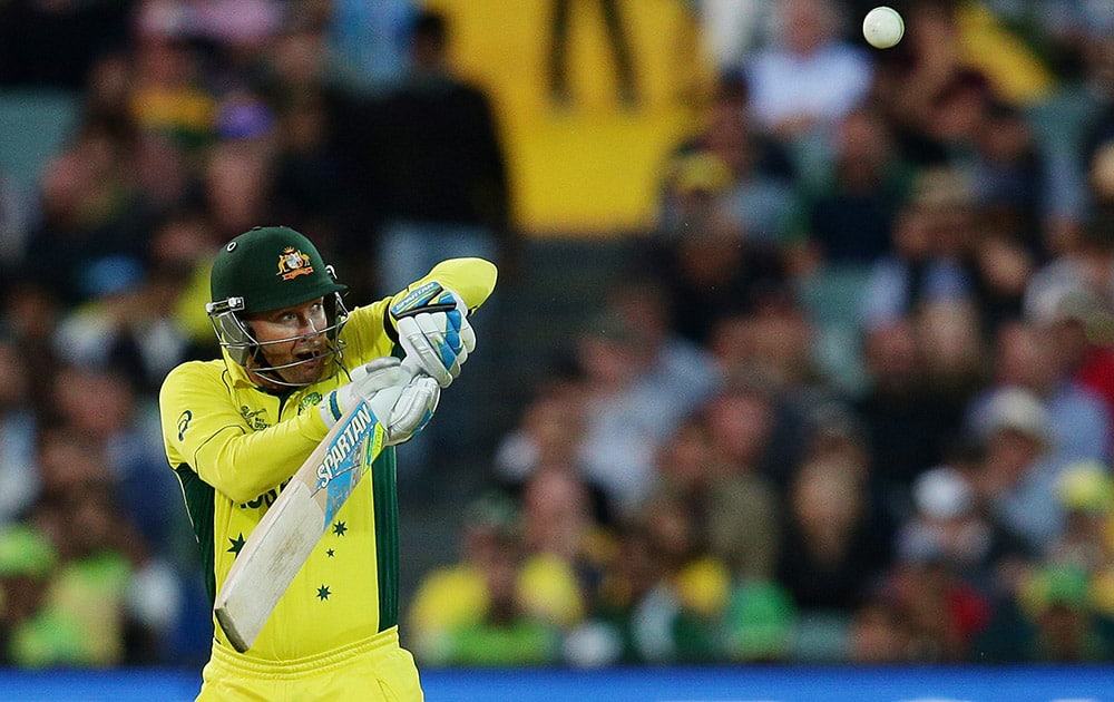 Australia's Michael Clarke watches as he hits the ball to a Pakistan fielder Sohaib Maqsood to be dismissed for eight runs during their Cricket World Cup quarterfinal match in Adelaide, Australia.