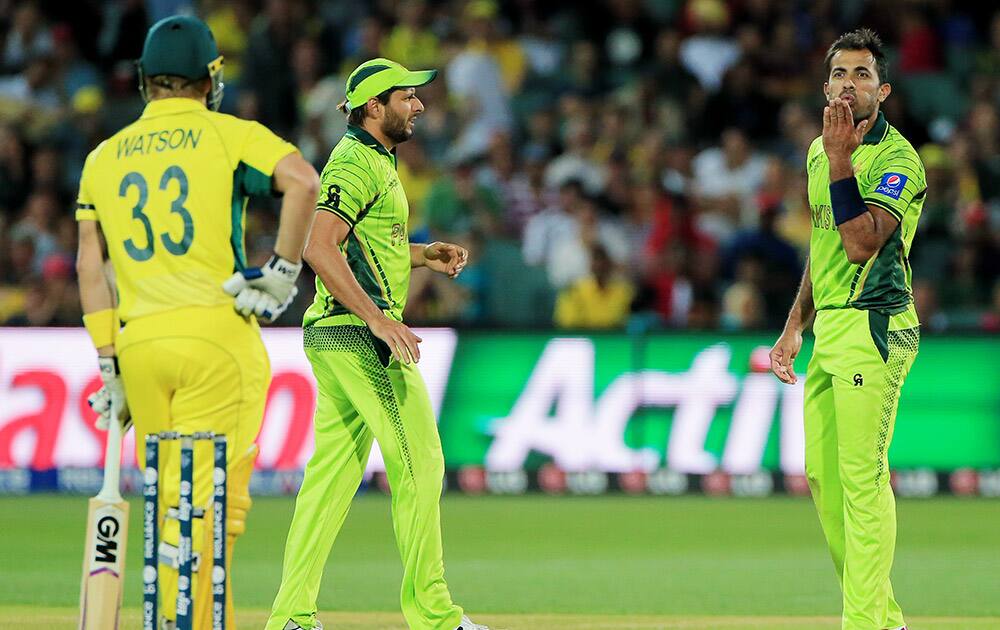 Pakistan's Wahab Riaz blows a kiss to Australia's Shane Watson, left, during their Cricket World Cup quarterfinal match in Adelaide, Australia.