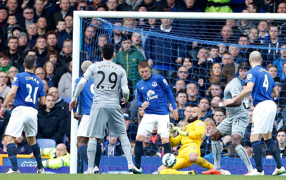 Everton Goalkeeper Tim Howard makes a save on the line during the English Premier League soccer match between Everton and Newcastle United at Goodison Park, Liverpool, England.